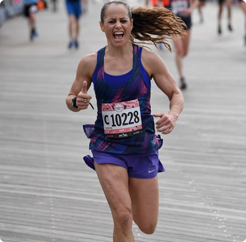 Coach Karyn Baig during a road race