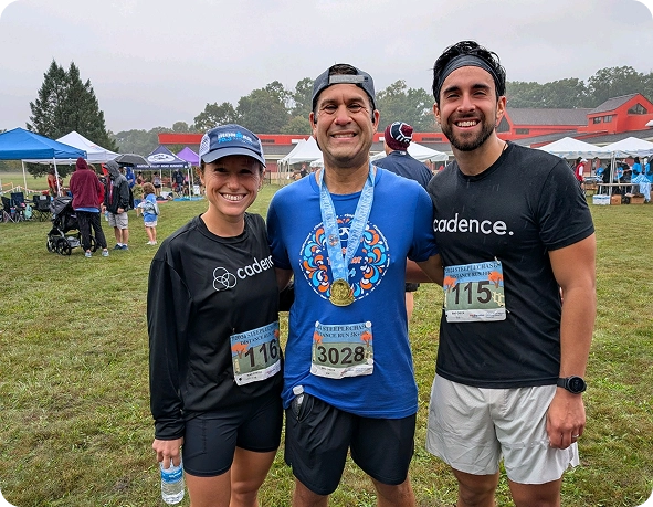Cadence coaches and athlete at a race event