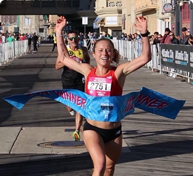 Coach Megan Pappalardo winning a race