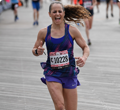 Coach Karyn Baig during a road race