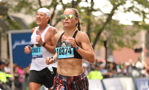 Coach Karyn Baig competing in a marathon